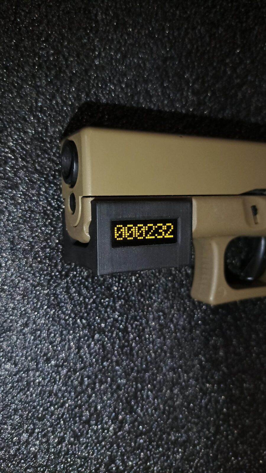 StatTrak device on an airsoft Glock, display 000232